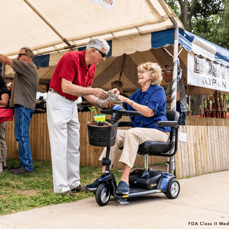 Woman using mobility scooter